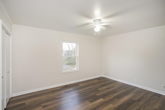 unfurnished room featuring ceiling fan, dark hardwood / wood-style flooring, and ornamental molding