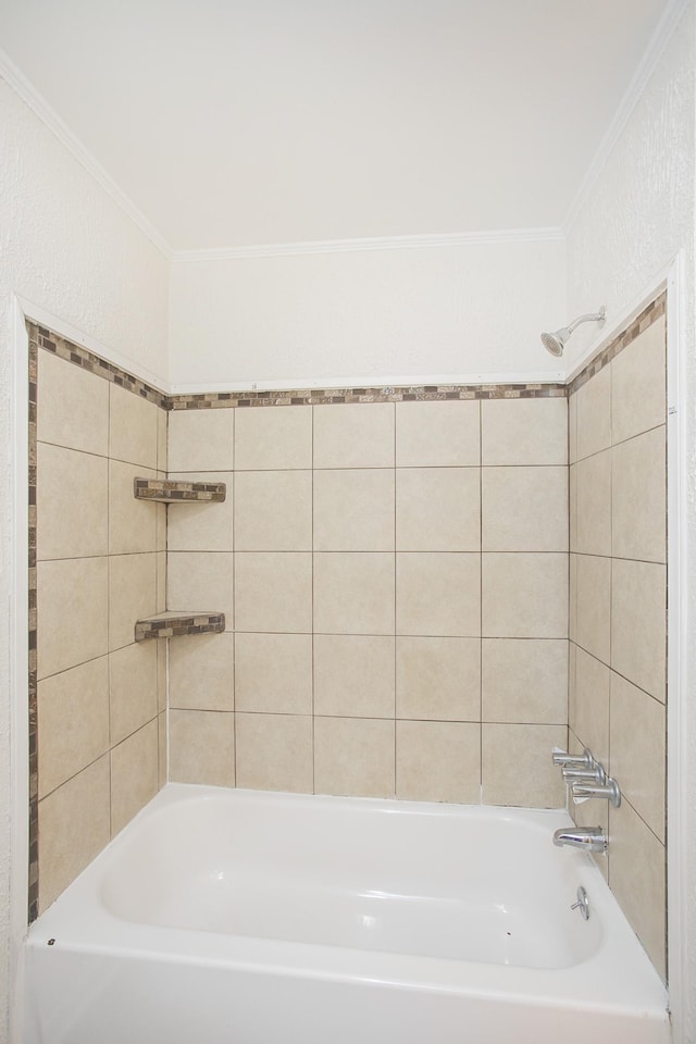 bathroom featuring tiled shower / bath combo and crown molding