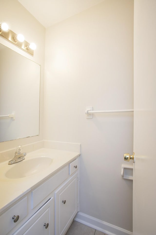 bathroom featuring tile patterned flooring and vanity