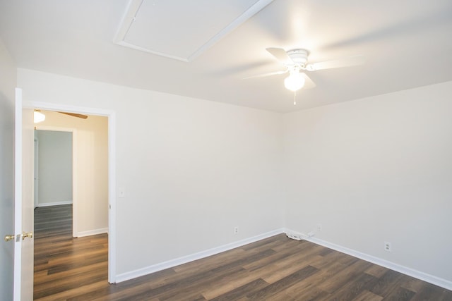 spare room with ceiling fan and dark hardwood / wood-style floors