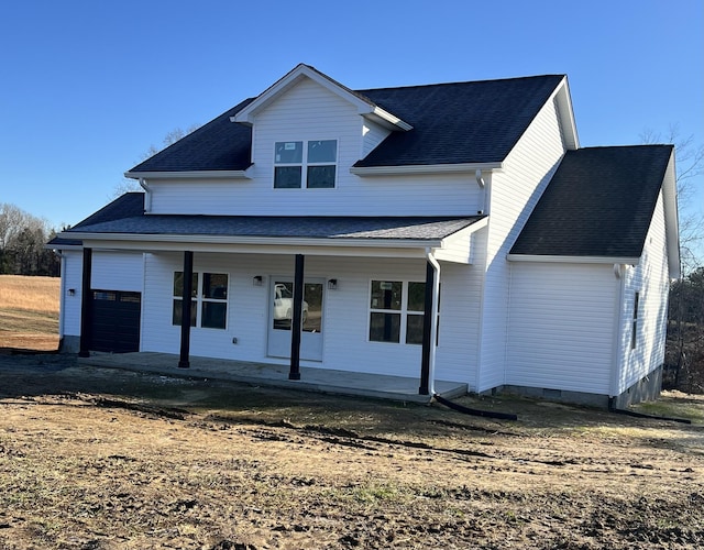 view of front of property with a garage and a porch