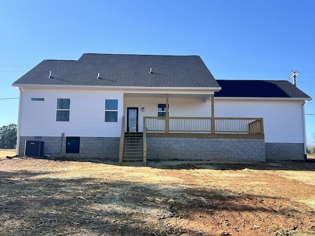 rear view of house with cooling unit