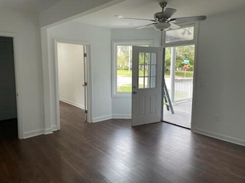 doorway to outside featuring dark hardwood / wood-style floors and ceiling fan