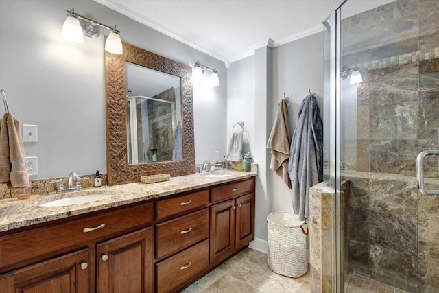 bathroom with vanity, a shower with shower door, and crown molding