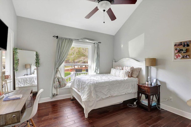 bedroom with ceiling fan, dark wood-type flooring, and vaulted ceiling