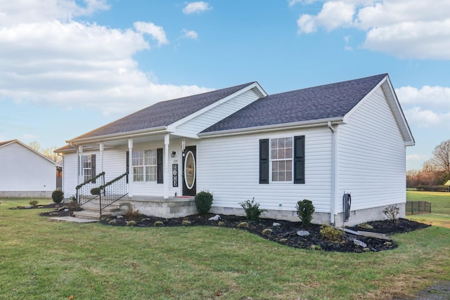 view of front of home with covered porch and a front yard