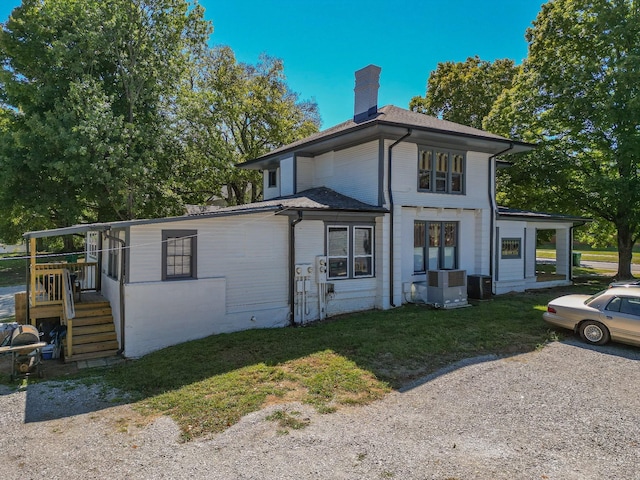 view of side of home with cooling unit