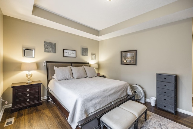 bedroom with dark wood-type flooring