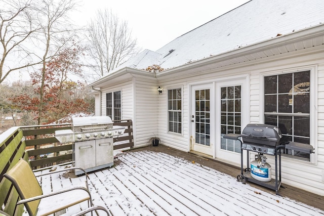 snow covered deck with area for grilling