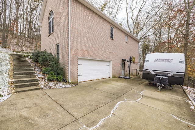 view of side of property featuring a garage