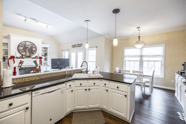 kitchen featuring white cabinets, sink, white dishwasher, and pendant lighting