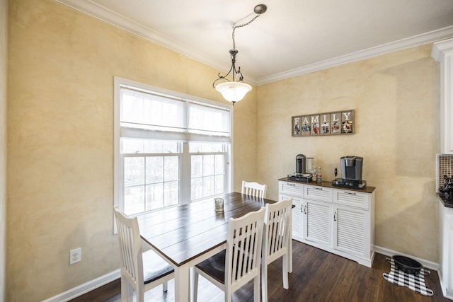 dining area featuring dark hardwood / wood-style flooring and ornamental molding