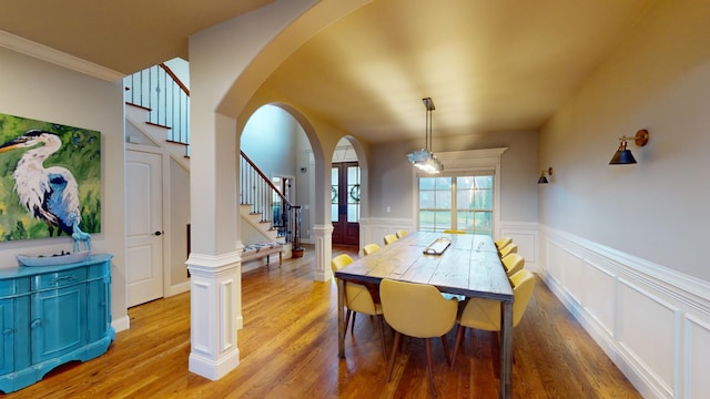 dining room featuring wood-type flooring and crown molding