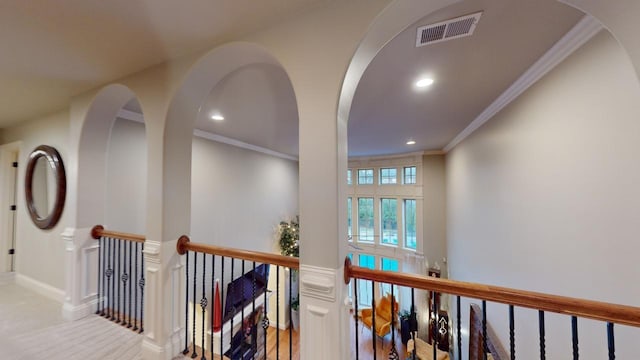 hallway featuring ornamental molding