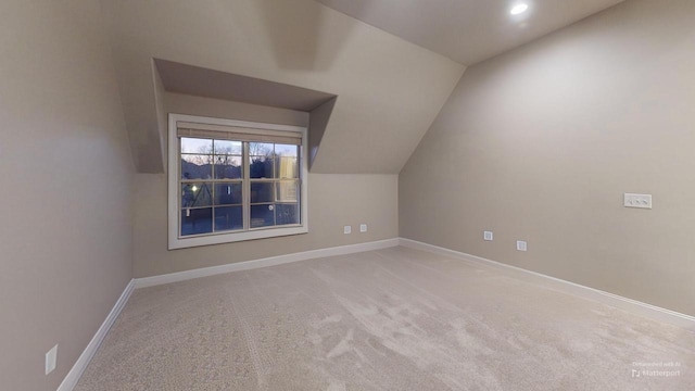 bonus room featuring carpet flooring and lofted ceiling