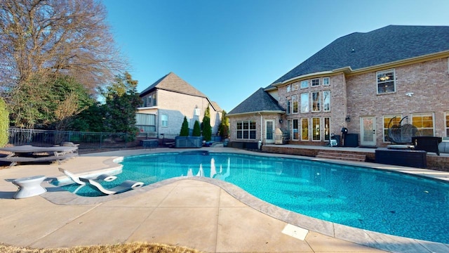 view of swimming pool featuring a patio area