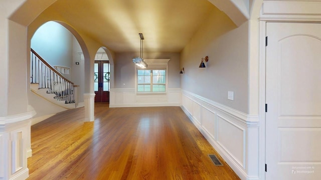 entrance foyer with french doors and wood-type flooring