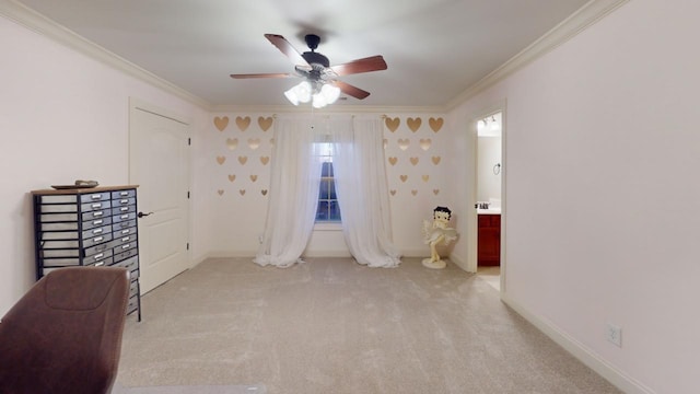 interior space with ceiling fan and crown molding