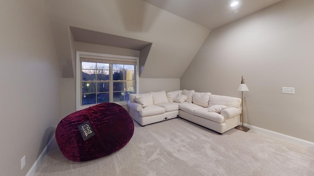 carpeted living room with lofted ceiling