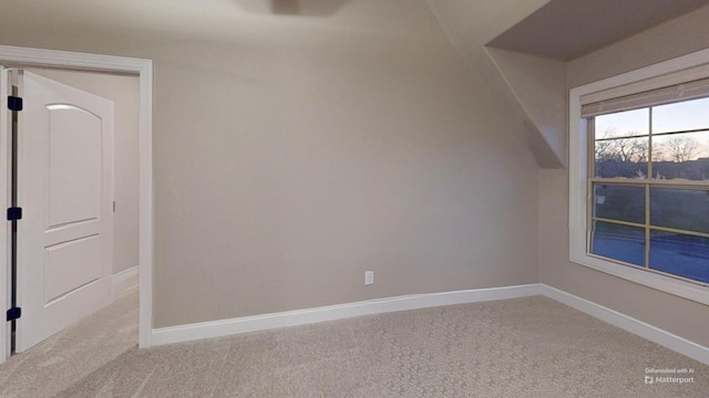 bonus room with carpet and vaulted ceiling