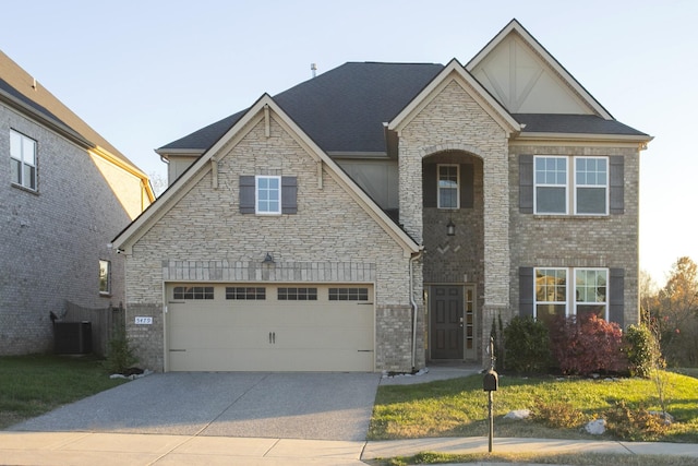 view of front of house featuring cooling unit and a garage