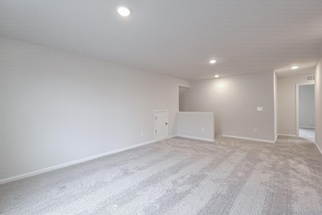 spare room with light carpet