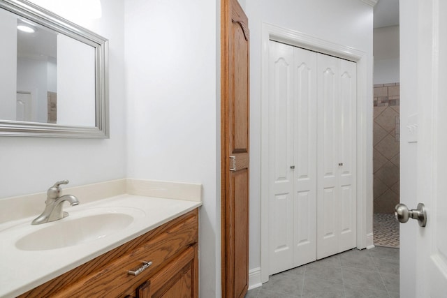 bathroom featuring tile patterned flooring and vanity