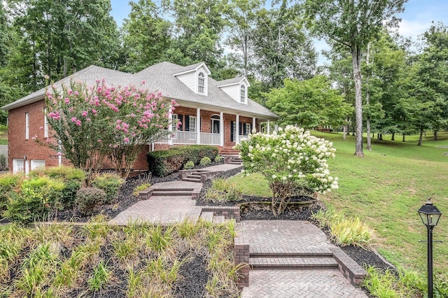 cape cod-style house with a porch and a front lawn