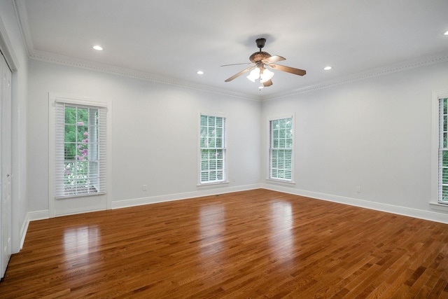 unfurnished room featuring wood-type flooring, ceiling fan, and ornamental molding