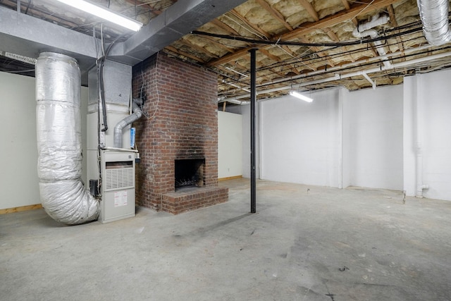 basement with a fireplace and heating unit