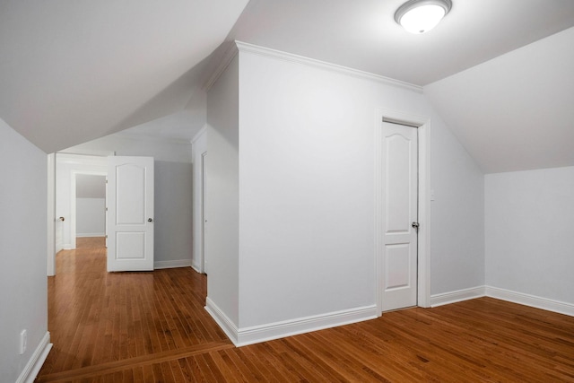 bonus room featuring hardwood / wood-style flooring and vaulted ceiling