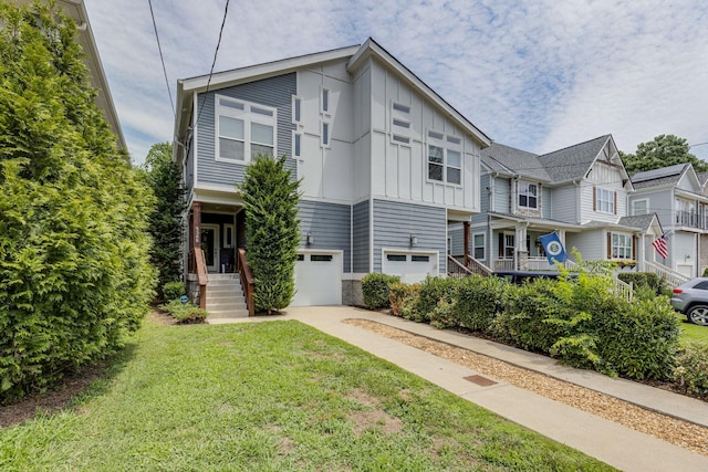 multi unit property featuring a front lawn and a garage