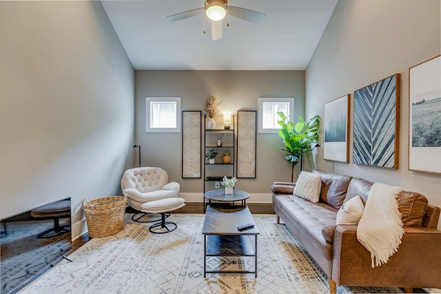 living room featuring ceiling fan and light wood-type flooring