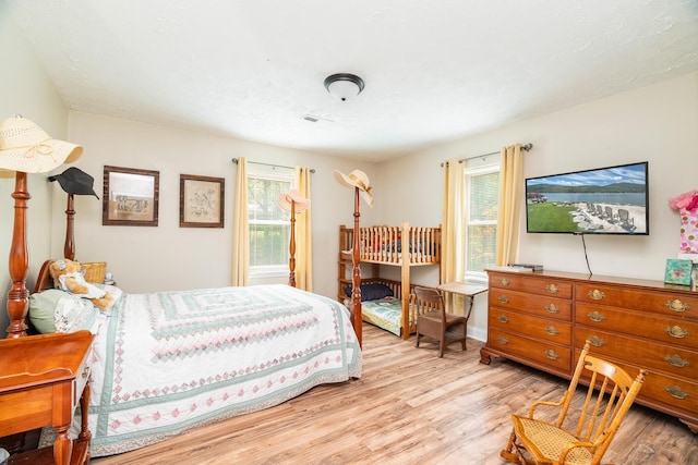 bedroom with light hardwood / wood-style floors