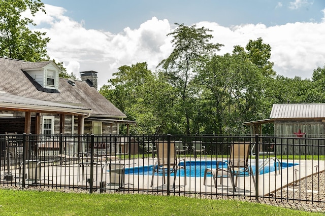 view of swimming pool with a patio area