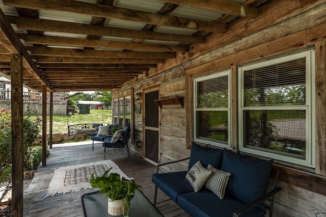 wooden terrace featuring outdoor lounge area