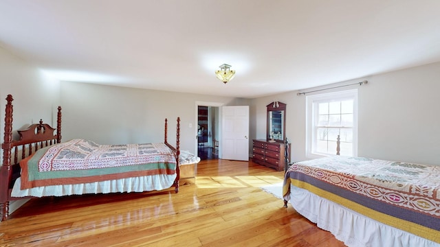 bedroom with wood-type flooring