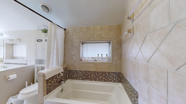 full bathroom with shower / tub combo, toilet, and sink