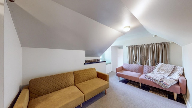 living room featuring lofted ceiling and light carpet