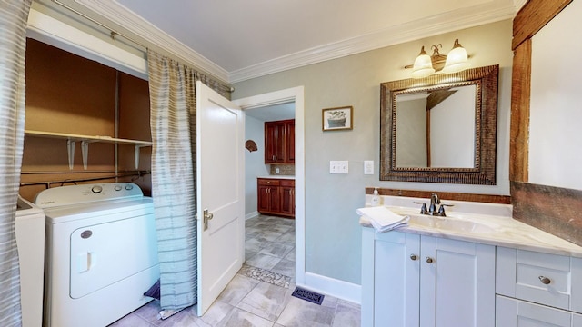 bathroom with vanity, washer and clothes dryer, and crown molding