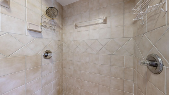 bathroom with a tile shower