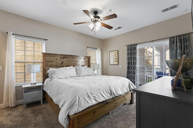 bedroom with access to exterior, ceiling fan, and dark colored carpet