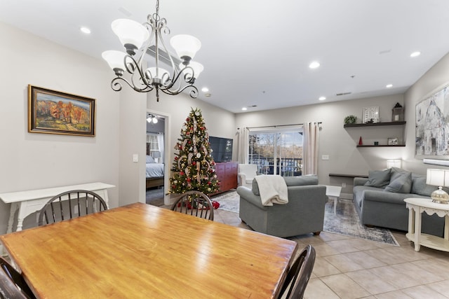 tiled dining area with an inviting chandelier