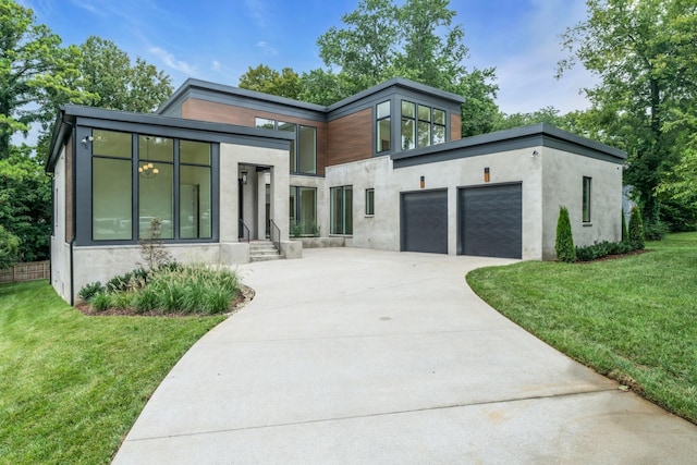 contemporary house with a garage and a front yard