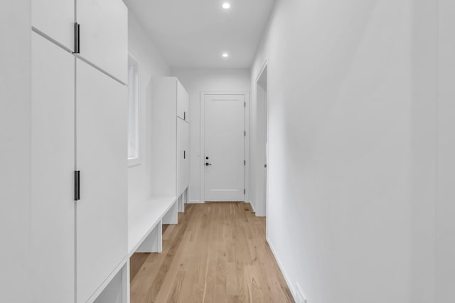 hall with light hardwood / wood-style floors