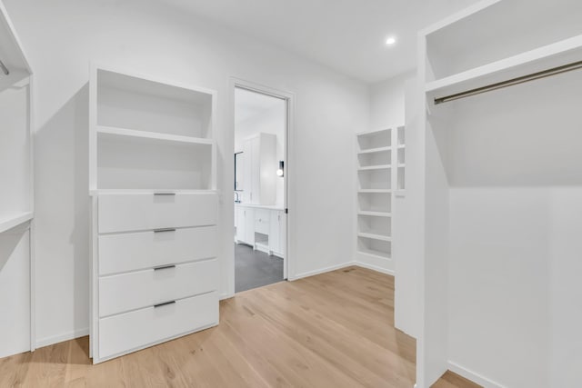 walk in closet featuring hardwood / wood-style flooring