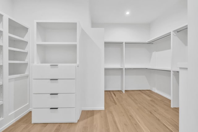 spacious closet with light hardwood / wood-style floors