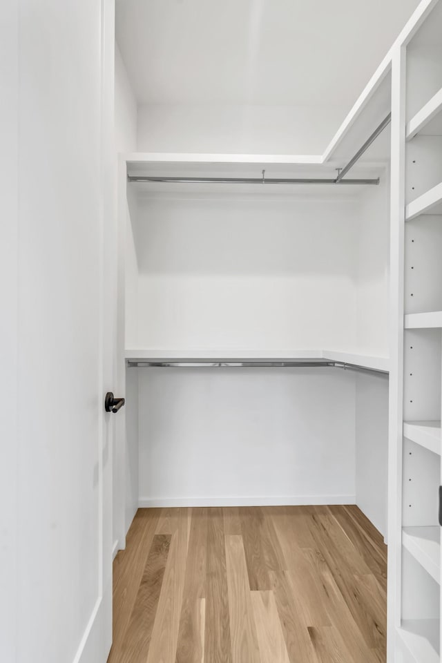 walk in closet featuring hardwood / wood-style floors