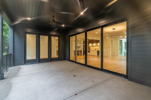 view of patio featuring a balcony and ceiling fan