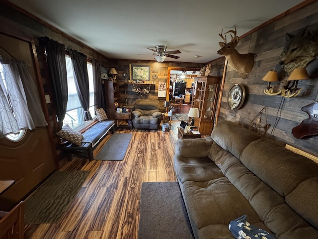 living room with ceiling fan and hardwood / wood-style floors